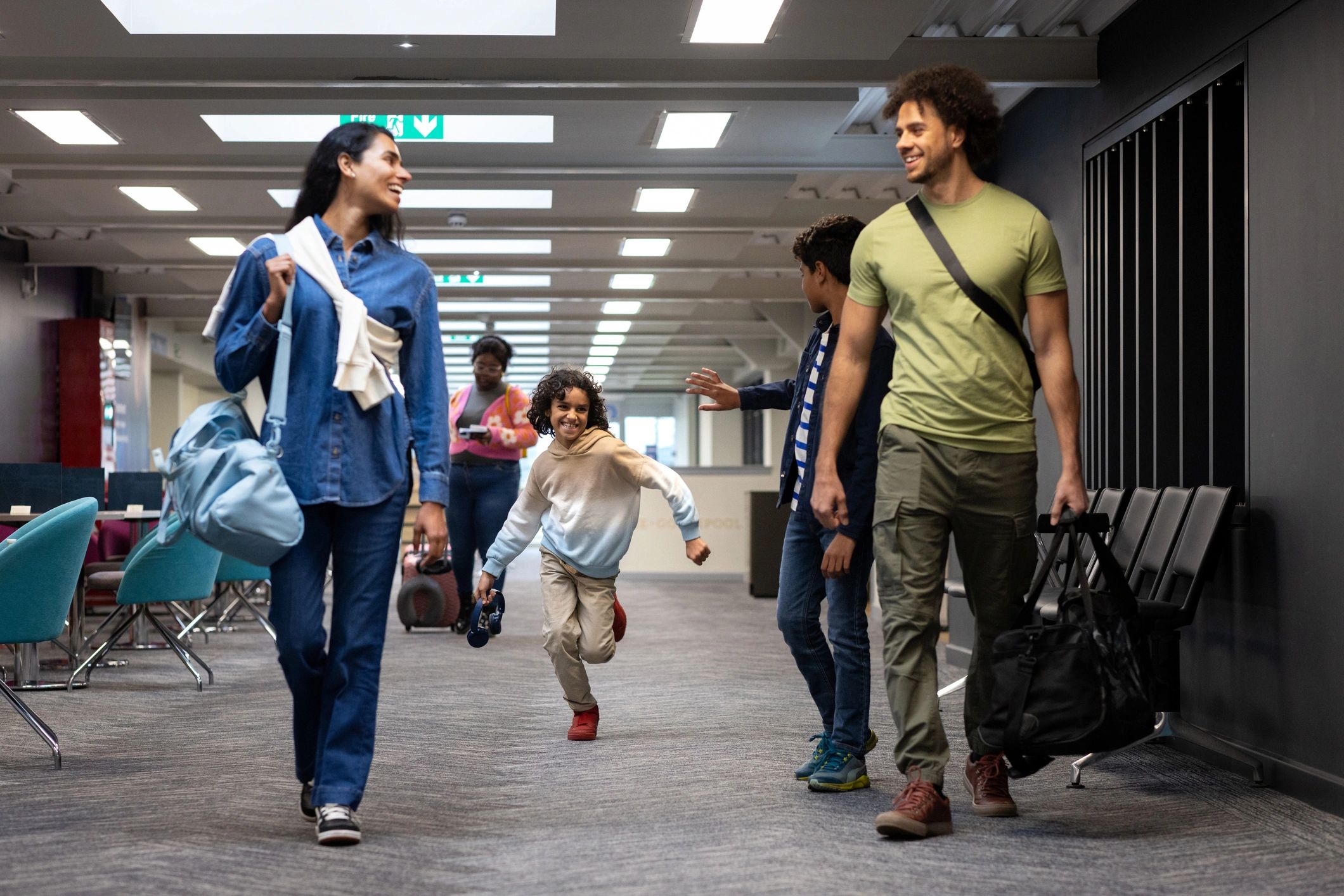 Passengers moving through a modern airport terminal