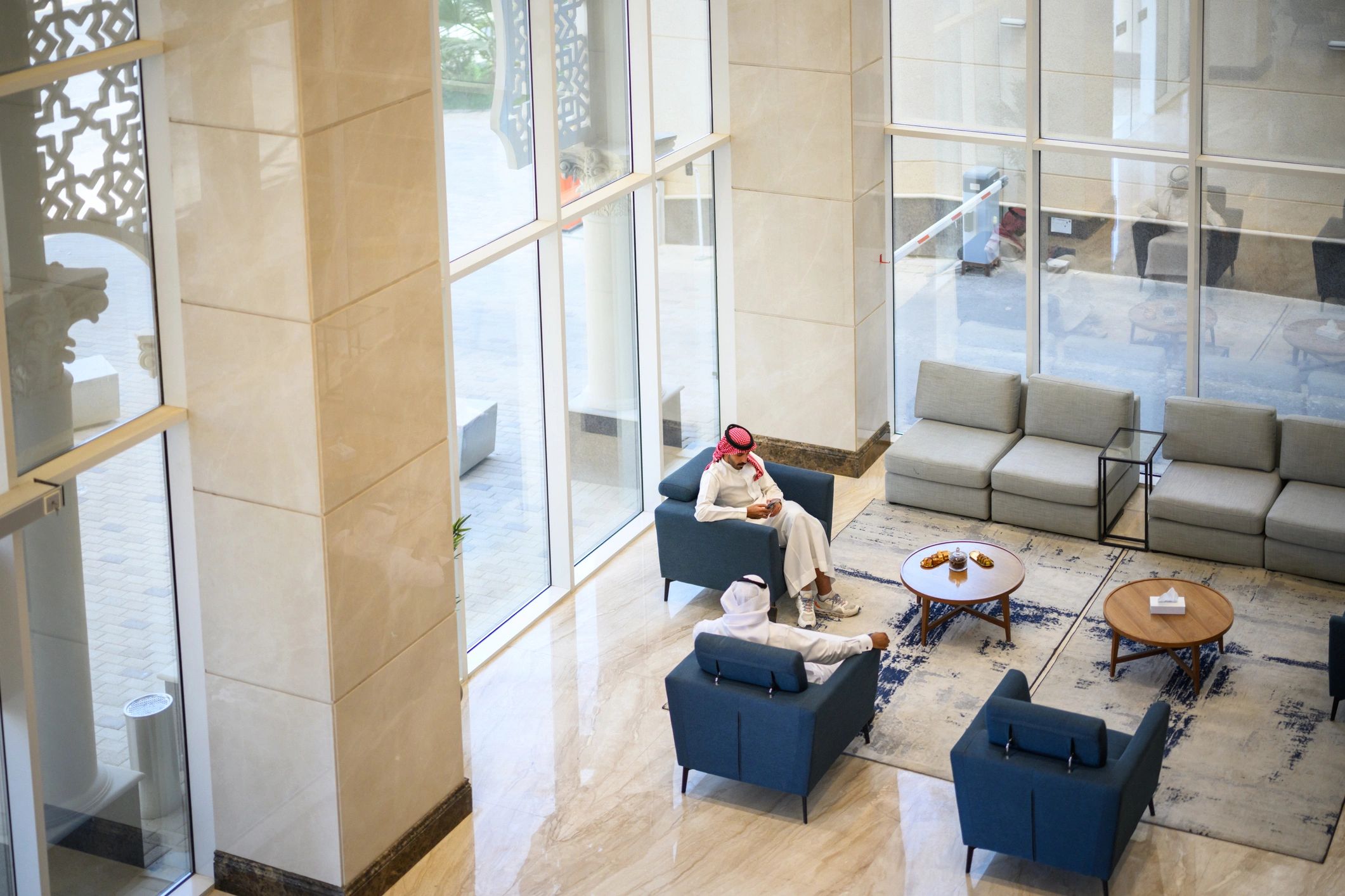 Business guests in premium lounge-style environment