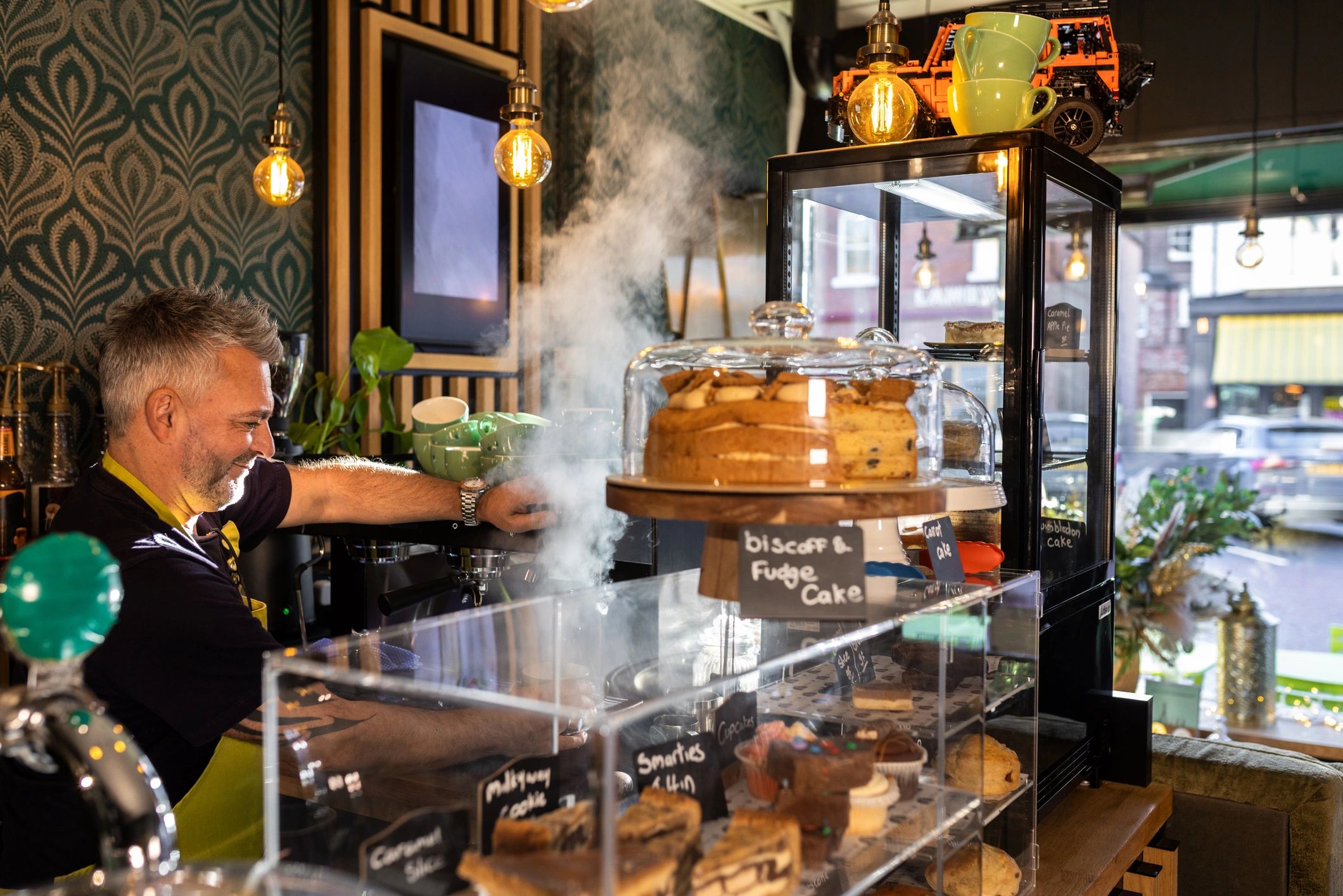 Barista preparing coffee at a professional café counter
